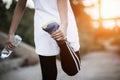 Young fitness woman hand holding water bottle after running Royalty Free Stock Photo