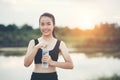 Young woman hand holding water bottle after running exercise Royalty Free Stock Photo