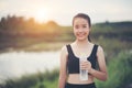Young fitness woman hand holding water bottle after running Royalty Free Stock Photo