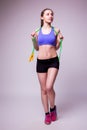 Young fitness woman with healthy sporty figure with skipping rope Royalty Free Stock Photo