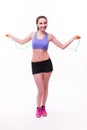 Young fitness woman with healthy sporty figure with skipping rope Royalty Free Stock Photo