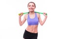 Young fitness woman with healthy sporty figure with skipping rope Royalty Free Stock Photo