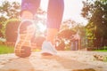 Young fitness woman legs walking in the morning for warm up body for jogging and exercise at outdoor public park