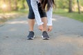 Young fitness woman legs walking in the park outdoor, female runner running on the road outside, asian athlete jogging and exercis Royalty Free Stock Photo