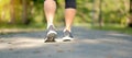 Young fitness woman legs walking in the park outdoor Royalty Free Stock Photo