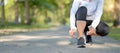 Young fitness woman legs walking in the park outdoor, female runner running on the road outside, asian athlete jogging and exercis Royalty Free Stock Photo