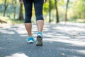 young fitness woman legs walking in the park outdoor, female runner running on the road outside, asian athlete jogging and exercis Royalty Free Stock Photo