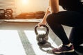 Woman standing on knee and preparing for cross fit exercise Royalty Free Stock Photo