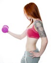 Young fitness woman lifting weights