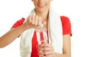Young fitness woman opening bottle of water
