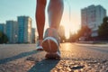 Young fitness woman runner athlete legs running on a morning city street