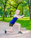 Young fitness woman runner stretching legs before run Royalty Free Stock Photo