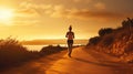 Young fitness woman running on sunrise seaside trail Royalty Free Stock Photo