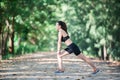 Young fitness woman stretching legs before run. Royalty Free Stock Photo