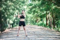 Young fitness woman stretching legs before run. Royalty Free Stock Photo