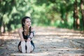 Young fitness woman stretching legs before run. Royalty Free Stock Photo