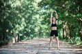 Young fitness woman stretching legs before run. Royalty Free Stock Photo