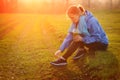 Young fitness woman taking a break outside in summer fitness workout.