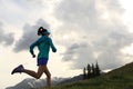 young fitness woman trail runner running on beautiful mountain peak Royalty Free Stock Photo