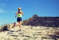 Woman trail runner running on the great wall top of mountain Royalty Free Stock Photo