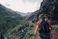 Young fitness woman trail runner running at mountain top