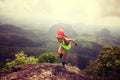 Woman trail runner running at mountain top Royalty Free Stock Photo