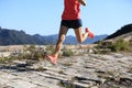 Fitness woman trail runner running on top of mountain Royalty Free Stock Photo