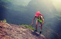 fitness woman trail runner running up to mountain top Royalty Free Stock Photo