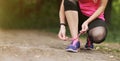 Young fitness woman tying shoelace running sneakers. Healthy fit living