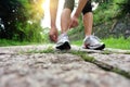 Young fitness woman tying shoelaces Royalty Free Stock Photo