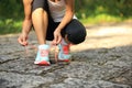 Young fitness woman tying shoelaces Royalty Free Stock Photo