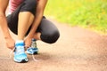 Young fitness woman tying shoelaces Royalty Free Stock Photo