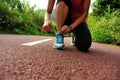 Young fitness woman tying shoelaces Royalty Free Stock Photo