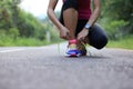 Young fitness woman tying shoelaces Royalty Free Stock Photo