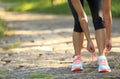 Young fitness woman tying shoelaces Royalty Free Stock Photo