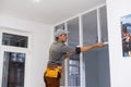 young fixer doing plasterboard partitioning Royalty Free Stock Photo