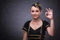 The young flight attendant on gray background Royalty Free Stock Photo