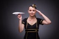 The young flight attendant on gray background Royalty Free Stock Photo