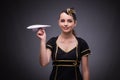 The young flight attendant on gray background Royalty Free Stock Photo