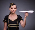 Young flight attendant on gray background Royalty Free Stock Photo