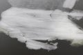 Young floating ice with folded structure on the river surface Royalty Free Stock Photo