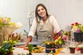 Young florist woman in a flower shop Royalty Free Stock Photo