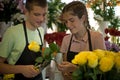Young florists work in a flower shop Royalty Free Stock Photo