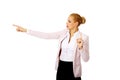 Young focus business woman explaining something and pointing at board or copyspace