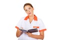 Young focus female doctor or nurse makes notes Royalty Free Stock Photo