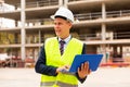 Young focused engineer controlling the progress of work on a laptop