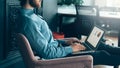 Young focused faceless man trader working on laptop computer Royalty Free Stock Photo