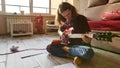 Young focused man play on electric guitar on floor Royalty Free Stock Photo