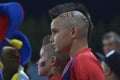 Young football fan with punk haircut