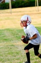 Young Football Player catching ball.